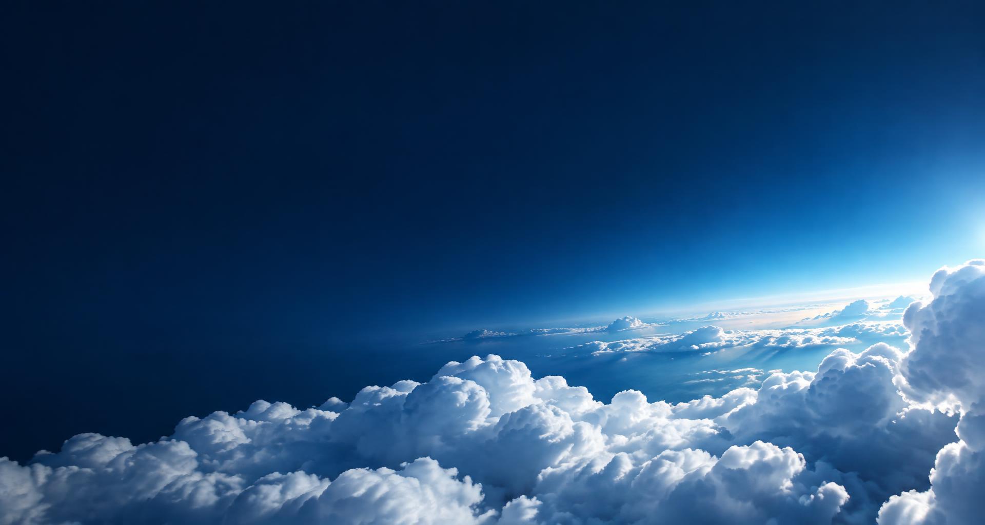 Sunlight illuminating a vast horizon of white clouds